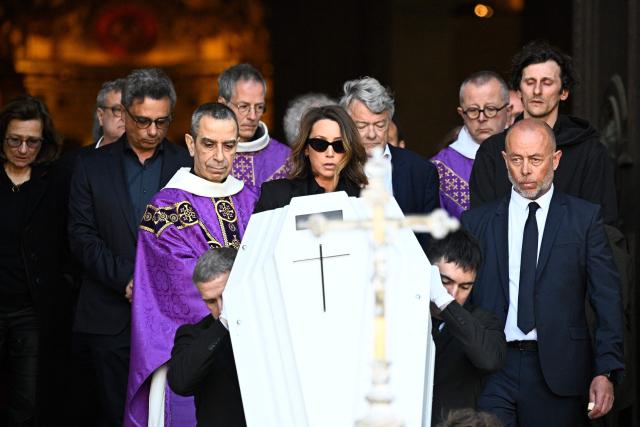 French actress Laura Smet follows the coffin after attending the funeral ceremony of her mother, French actress Nathalie Baye at the Saint-Sulpice church in Paris on April 24, 2026. French film star Nathalie Baye died on April 17, 2026, at the age of 77. (Photo by JULIEN DE ROSA / AFP)