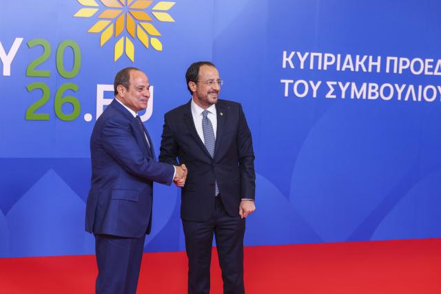 Cyprus' President Nikos Christodoulides (R) welcomes Egypt's President Abdel Fattah al-Sisi in Nicosia on April 24, 2026, on the sidelines of a European summit. European leaders vowed on April 24 to do more to de-escalate conflicts in the Middle East, as they prepared for discussions with regional counterparts from Egypt, Lebanon and Syria in Cyprus. (Photo by Yves Herman / POOL / AFP)