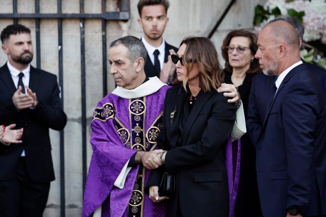 French actress Laura Smet is comforted as she leaves after attending the funeral ceremony of her mother, French actress Nathalie Baye at the Saint-Sulpice church in Paris on April 24, 2026. French film star Nathalie Baye died on April 17, 2026, at the age of 77. (Photo by STEPHANE DE SAKUTIN / AFP)