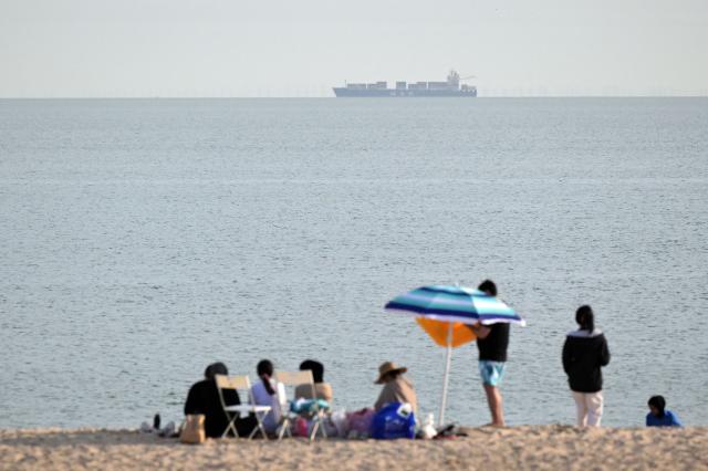 A cargo ship of the Mediterranean Shipping Company (MSC) sails in the Gulf waters off Kuwait City on April 24, 2026. (Photo by YASSER AL-ZAYYAT / AFP)