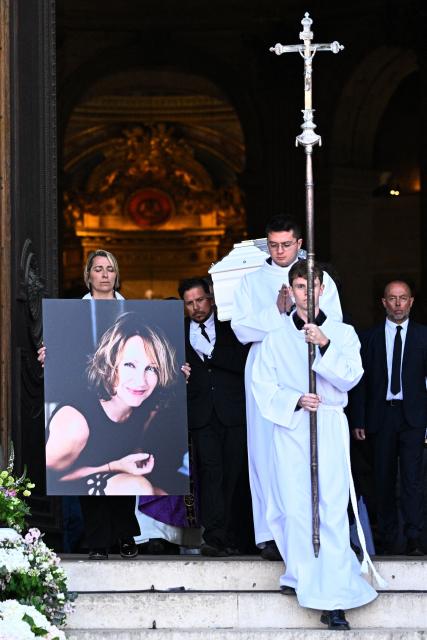 Pall-bearers carry the coffin of French actress Nathalie Baye after her funeral ceremony at the Saint-Sulpice church in Paris on April 24, 2026. French film star Nathalie Baye died on April 17, 2026, at the age of 77. (Photo by JULIEN DE ROSA / AFP)