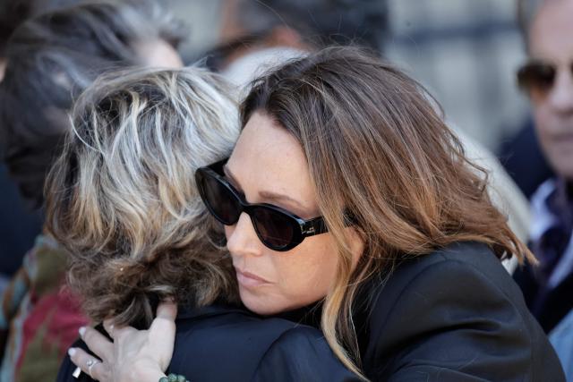 French actress Laura Smet is comforted after attending the funeral ceremony of her mother, French actress Nathalie Baye at the Saint-Sulpice church in Paris on April 24, 2026. French film star Nathalie Baye died on April 17, 2026, at the age of 77. (Photo by STEPHANE DE SAKUTIN / AFP)