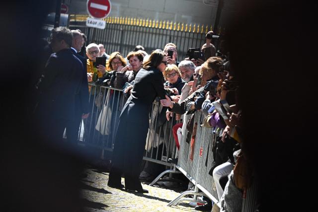 French actress Laura Smet receives condolences from mourners after attending the funeral ceremony of her mother, French actress Nathalie Baye at the Saint-Sulpice church in Paris on April 24, 2026. French film star Nathalie Baye died on April 17, 2026, at the age of 77. (Photo by JULIEN DE ROSA / AFP)