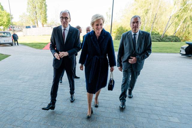 Belgian biopharmaceutical company UCB CEO Jean-Christophe Tellier (L) and Princess Astrid of Belgium (C) arrive at the inauguration of the new gene therapy site at the Braine l'Alleud campus of biopharmaceutical company UCB, in Braine-L'alleud, on the outskirts of Brussels, on April 24, 2026. (Photo by EMILE WINDAL / Belga / AFP) / Belgium OUT