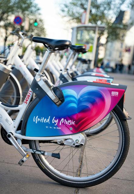 This picture shows an advertisement for the Eurovision Song Contest (ESC) on a 'WienMobile' bike, on April 24, 2026, in Vienna, Austria. The Austrian capital Vienna will host the Eurovision Song Contest 2026 from May 12 to 16, 2026. (Photo by MAX HERBST / APA / AFP) / Austria OUT