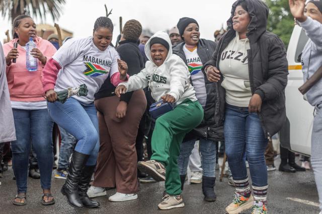 Protesters sing and chant during a protest march against undocumented migrants in the town of Estcourt on April 24, 2026. South Africa's acting police minister has condemned xenophobic incidents, saying attacks on foreign nationals were "unlawful" and violated the country's constitutional values of dignity and equality. (Photo by RAJESH JANTILAL / AFP)