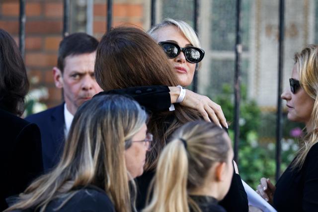 Former French model Laeticia Hallyday greets attendees before the funeral ceremony of French actress Nadia Fares at the Saint-Jean de Montmartre church in Paris on April 24, 2026. Nadia Fares died on April 17, 2026, aged 57, after being found unconscious in a swimming pool in Paris and several days in a coma. (Photo by SIMON WOHLFAHRT / AFP)