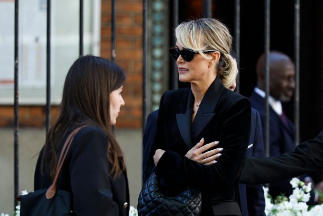 Former French model Laeticia Hallyday arrives for the funeral ceremony of French actress Nadia Fares at the Saint-Jean de Montmartre church in Paris on April 24, 2026. Nadia Fares died on April 17, 2026, aged 57, after being found unconscious in a swimming pool in Paris and several days in a coma. (Photo by SIMON WOHLFAHRT / AFP)