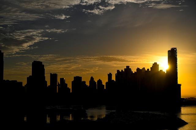 The sun rises over the city skyline in Panama City on April 24, 2026. (Photo by MARTIN BERNETTI / AFP)
