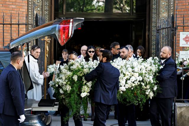 Pallbearers carry the coffin of French actress Nadia Fares after the funeral ceremony at the Saint-Jean de Montmartre church in Paris on April 24, 2026. Nadia Fares died on April 17, 2026, aged 57, after being found unconscious in a swimming pool in Paris and several days in a coma. (Photo by SIMON WOHLFAHRT / AFP)