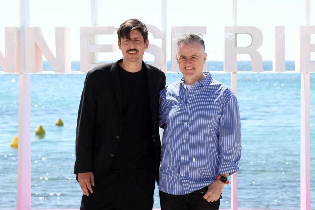 Swiss journalist and protagonist Antoine Harari (L) and protagonist Ezra Chowaiki pose during the "The Oligarch and the Art Dealer" photocall as part of the 9th edition of the Cannes International Series Festival (Canneseries) in Cannes, southern France, on April 24, 2026. (Photo by Valery HACHE / AFP)