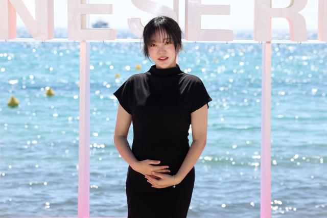 Actress Jiin Moon poses during the "Genfluencer" photocall as part of the 9th edition of the Cannes International Series Festival (Canneseries) in Cannes, southern France, on April 24, 2026. (Photo by Valery HACHE / AFP)