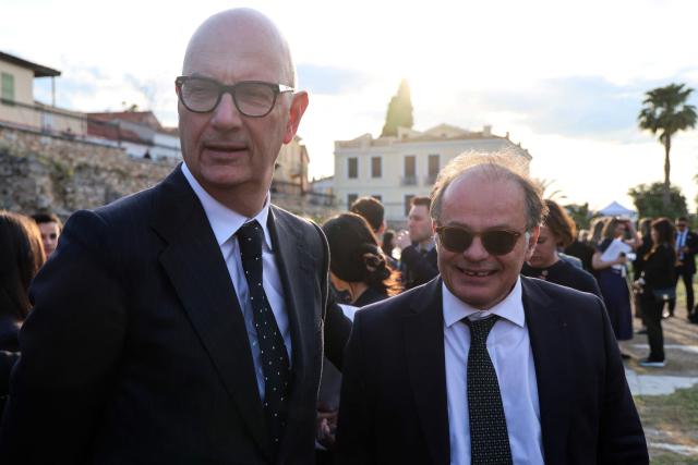 France's Economy and Finance Minister Roland Lescure (L) and Secretary General of the French Presidency Emmanuel Moulin (R) arrive for an event with France's President and Greece's Prime Minister at the Roman Agora in Athens, on April 24, 2026. Emmanuel Macron is in a two-days visit to Greece to strengthen Franco-Greek cooperation on defence and security. (Photo by Ludovic MARIN / AFP)