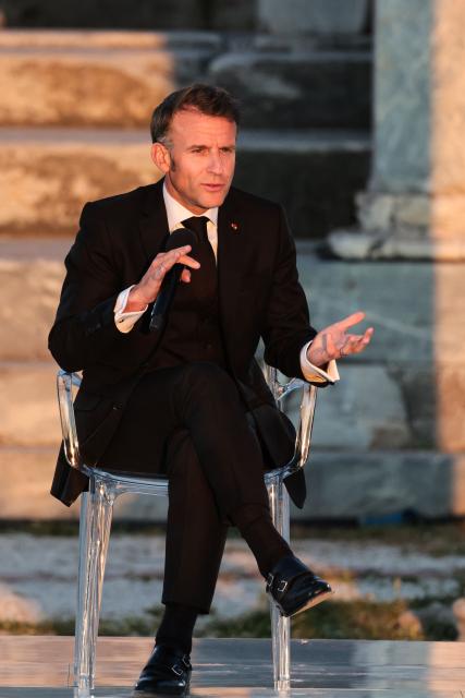 France's President Emmanuel Macron speaks on stage during an event at the Roman Agora in Athens, on April 24, 2026. Emmanuel Macron is in a two-days visit to Greece to strengthen Franco-Greek cooperation on defence and security. (Photo by Ludovic MARIN / AFP)