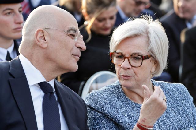 Greece's Defence Minister Nikolaos Dendias (L) and France's Defence Minister Catherine Vautrin speak during an event with France's President and Greece's Prime Minister at the Roman Agora in Athens, on April 24, 2026. Emmanuel Macron is in a two-days visit to Greece to strengthen Franco-Greek cooperation on defence and security. (Photo by Ludovic MARIN / AFP)