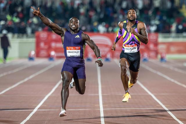 Kenya’s Ferdinand Omanyala (L) celebrates as he crosses the finish line to win the 100m men's event during the sixth edition of the Kip Keino Classic Continental Tour Gold at the Nyayo National Stadium in Nairobi, on April 24, 2026. (Photo by Luis TATO / AFP)