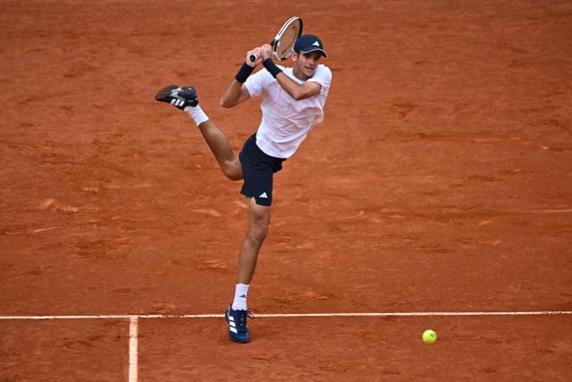Spain's Rafael Jodar returns a shot to Australia's Alex De Minaur during their 2026 ATP Tour Madrid Open tennis tournament second round singles match at the Caja Magica in Madrid, on April 24, 2026. (Photo by Javier SORIANO / AFP)