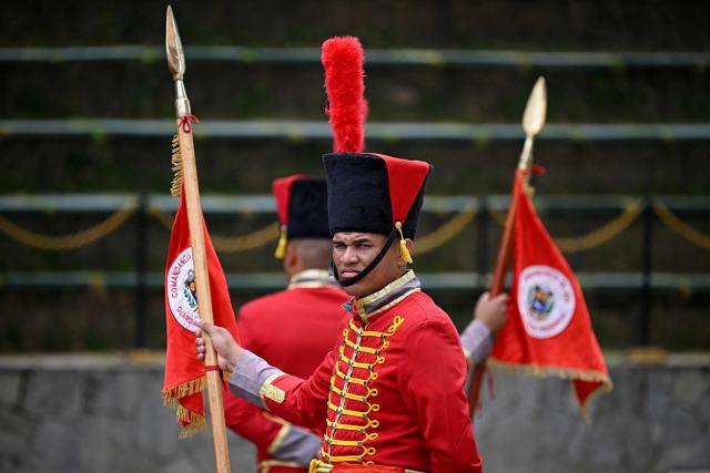 A Presidential Honor Guard looks on before the arrival of Colombia's President Gustavo Petro at a bilateral meeting at the Miraflores Presidential Palace in Caracas on April 24, 2026. Colombia's President Gustavo Petro arrived in Venezuela on April 24 for a bilateral meeting with interim President Delcy Rodríguez, focusing on border security and energy cooperation. (Photo by Federico PARRA / AFP)