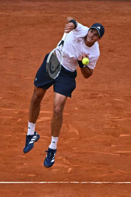 Spain's Rafael Jodar serves a shot to Australia's Alex De Minaur during their 2026 ATP Tour Madrid Open tennis tournament second round singles match at the Caja Magica in Madrid, on April 24, 2026. (Photo by Javier SORIANO / AFP)