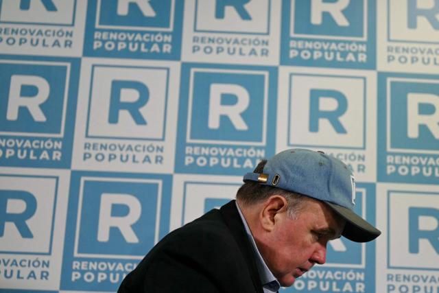 Peru’s presidential candidate for the Renovacion Popular party, Rafael Lopez Aliaga, looks on during a press conference at their campaign headquarters in Lima on April 24, 2026. (Photo by ERNESTO BENAVIDES / AFP)