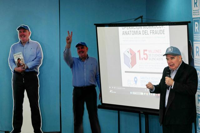 Peru’s presidential candidate for the Renovacion Popular party, Rafael Lopez Aliaga, speaks during a press conference at their campaign headquarters in Lima on April 24, 2026. (Photo by ERNESTO BENAVIDES / AFP)