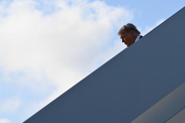 US President Donald Trump steps off Air Force One at Palm Beach International Airport in West Palm Beach, Florida on April 24, 2026. President Trump is heading to Palm Beach to attend the Republican National Committee (RNC) spring retreat. (Photo by Kent NISHIMURA / AFP)