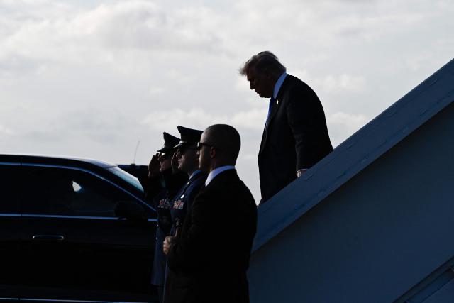 US President Donald Trump steps off Air Force One at Palm Beach International Airport in West Palm Beach, Florida on April 24, 2026. President Trump is heading to Palm Beach to attend the Republican National Committee (RNC) spring retreat. (Photo by Kent NISHIMURA / AFP)