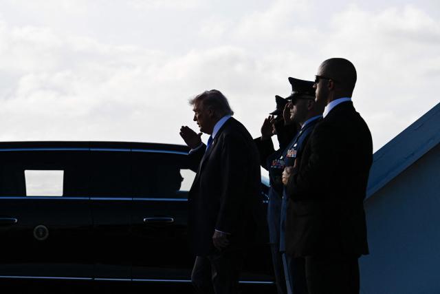 US President Donald Trump steps off Air Force One at Palm Beach International Airport in West Palm Beach, Florida on April 24, 2026. President Trump is heading to Palm Beach to attend the Republican National Committee (RNC) spring retreat. (Photo by Kent NISHIMURA / AFP)