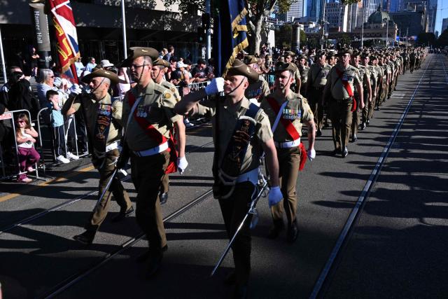 Soldiers march to the Shrine of Remembrance during a parade of former and current defence personnel on ANZAC (Australian and New Zealand Army Corps) Day to honour soldiers who have died in the line of duty, in Melbourne on April 25, 2026. (Photo by William WEST / AFP)