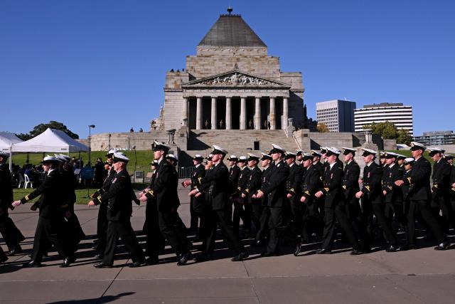 Sailors march to the Shrine of Remembrance during a parade of former and current defence personnel on ANZAC (Australian and New Zealand Army Corps) Day to honour soldiers who have died in the line of duty, in Melbourne on April 25, 2026. (Photo by William WEST / AFP)