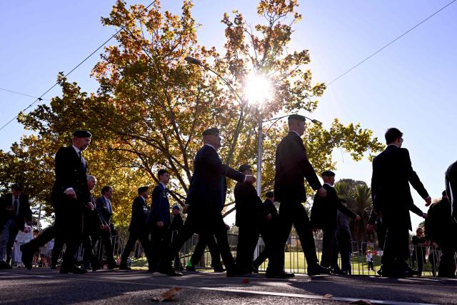 Ex-servicemen march to the Shrine of Remembrance during a parade of former and current defence personnel on ANZAC (Australian and New Zealand Army Corps) Day to honour soldiers who have died in the line of duty, in Melbourne on April 25, 2026. (Photo by William WEST / AFP)
