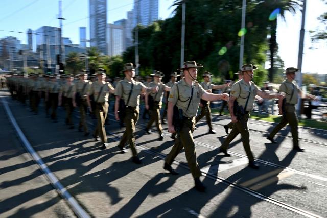 Soldiers march to the Shrine of Remembrance during a parade of former and current defence personnel on ANZAC (Australian and New Zealand Army Corps) Day to honour soldiers who have died in the line of duty, in Melbourne on April 25, 2026. (Photo by William WEST / AFP)
