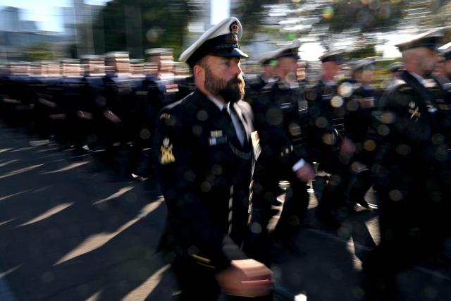 Sailors march to the Shrine of Remembrance during a parade of former and current defence personnel on ANZAC (Australian and New Zealand Army Corps) Day to honour soldiers who have died in the line of duty, in Melbourne on April 25, 2026. (Photo by William WEST / AFP)
