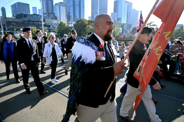 Ex-servicemen march to the Shrine of Remembrance during a parade of former and current defence personnel on ANZAC (Australian and New Zealand Army Corps) Day to honour soldiers who have died in the line of duty, in Melbourne on April 25, 2026. (Photo by William WEST / AFP)