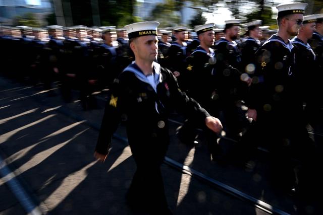 Sailors march to the Shrine of Remembrance during a parade of former and current defence personnel on ANZAC (Australian and New Zealand Army Corps) Day to honour soldiers who have died in the line of duty, in Melbourne on April 25, 2026. (Photo by William WEST / AFP)