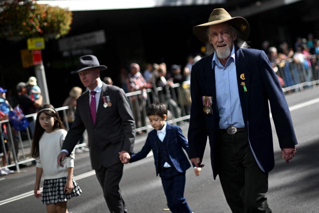 Former servicemen and women participate in the annual ANZAC (Australian and New Zealand Army Corps) Day parade in Sydney on April 25, 2026. Dawn services were held across the two countries on the anniversary of the ill-fated 1915 campaign of the Australian and New Zealand Army Corps that left 11,500 of them dead in what is now Turkey during World War I. (Photo by Saeed KHAN / AFP)