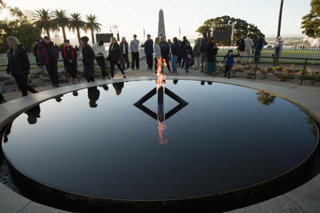 Members of the armed forces and general public gather at the State War Memorial in Kings Park during the annual ANZAC (Australian and New Zealand Army Corps) Day dawn service in Perth on April 25, 2026. Dawn services were held across the two countries on the anniversary of the ill-fated 1915 campaign of the Australian and New Zealand Army Corps that left 11,500 of them dead in what is now Turkey during World War I. (Photo by Antony DICKSON / AFP)