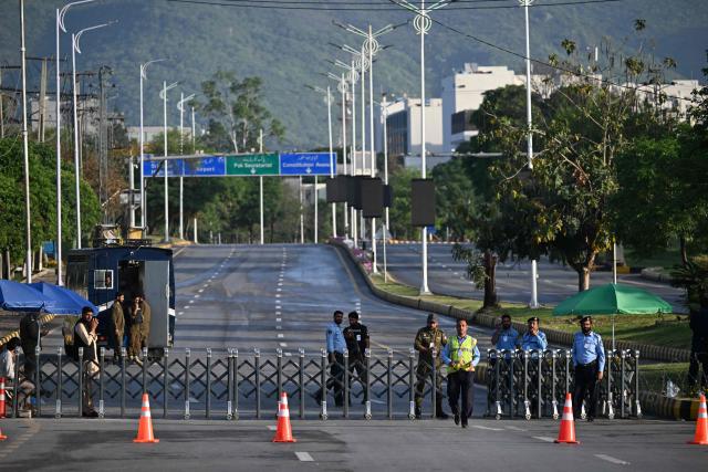 Police officers stand guard near the Serena Hotel, the venue for expected US-Iran talks, in Islamabad’s Red Zone on April 25, 2026. Iran's foreign minister arrived in Islamabad on April 24 and US envoys headed to the Pakistani capital in a bid to kickstart a new round of peace negotiations amid a fragile ceasefire. (Photo by Aamir QURESHI / AFP)