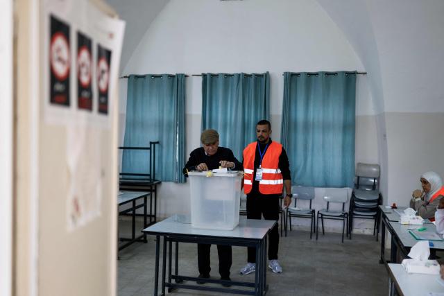 A Palestinian man casts his vote during municipal elections in the Israeli-occupied West Bank city of Jenin on April 25, 2026. Palestinians in the West Bank and a central area of Gaza began voting on April 25 in municipal elections in a first vote since the Gaza war, marked by a narrow political field and widespread disillusionment. (Photo by Marco Longari / AFP)