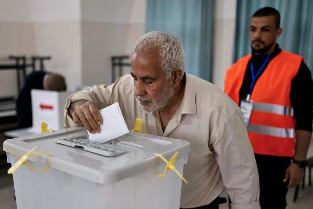 A Palestinian man casts his vote during municipal elections in the Israeli-occupied West Bank city of Jenin on April 25, 2026. Palestinians in the West Bank and a central area of Gaza began voting on April 25 in municipal elections in a first vote since the Gaza war, marked by a narrow political field and widespread disillusionment. (Photo by Marco Longari / AFP)