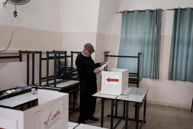A Palestinian man casts his vote during municipal elections in the Israeli-occupied West Bank city of Jenin on April 25, 2026. Palestinians in the West Bank and a central area of Gaza began voting on April 25 in municipal elections in a first vote since the Gaza war, marked by a narrow political field and widespread disillusionment. (Photo by Marco Longari / AFP)