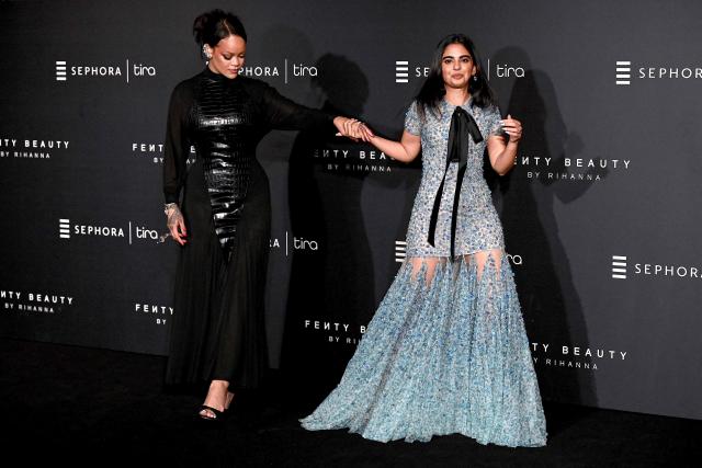 Barbadian singer and businesswoman Rihanna (L) and Isha Ambani, daughter of Chairman of Reliance Industries Mukesh Ambani, pose for photographs during an event of Rihanna's cosmetic brand 'Fenty Beauty' in Mumbai on April 25, 2026. (Photo by Sujit JAISWAL / AFP)