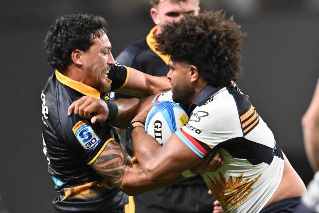 Brumbies' Rob Valetini (R) is tackled by Hurricanes' Billy Proctor during the Super Rugby Pacific match between the Hurricanes and Brumbies at One New Zealand Stadium in Christchurch on April 25, 2026. (Photo by Sanka VIDANAGAMA / AFP)