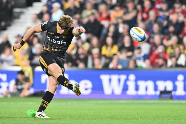 Hurricanes' Ruben Love kicks a goal during the Super Rugby Pacific match between the Hurricanes and Brumbies at One New Zealand Stadium in Christchurch on April 25, 2026. (Photo by Sanka Vidanagama / AFP)