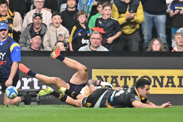 Hurricanes' Josh Moorby (R) scores a try during the Super Rugby Pacific match between the Hurricanes and Brumbies at One New Zealand Stadium in Christchurch on April 25, 2026. (Photo by Sanka Vidanagama / AFP)