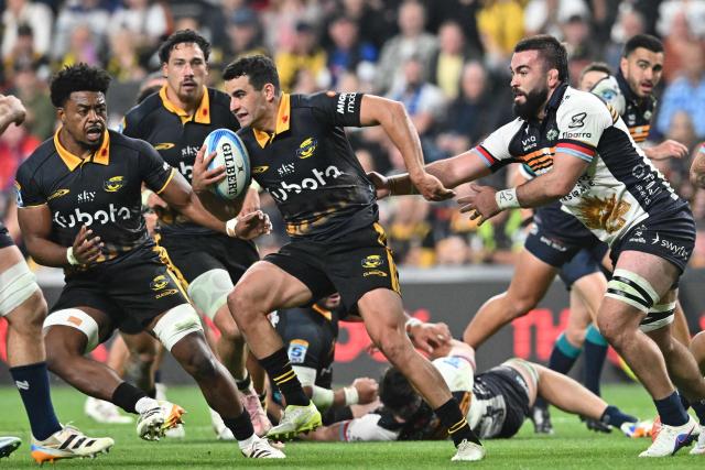Hurricanes' Josh Moorby (C) charges forward during the Super Rugby Pacific match between the Hurricanes and Brumbies at One New Zealand Stadium in Christchurch on April 25, 2026. (Photo by Sanka Vidanagama / AFP)