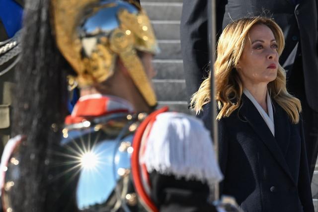 Italy’s prime Minister Giorgia Meloni (R) attends the wreath-laying ceremony at the Altare della Patria of Unknown Soldier on the occasion of the 81st Anniversary of the Liberation, in central Rome, on April 25, 2026. (Photo by Andreas SOLARO / AFP)