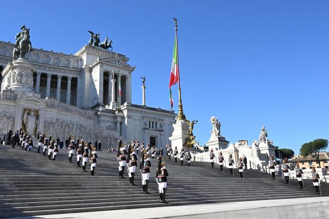 Corazzieri, or Italian military Presidential honour guards, take part in the wreath-laying ceremony at the Tomb of the Unknown Soldier of Victor Emmanuel II Monument for Italy's Liberation Day anniversary, in central Rome, on April 25, 2026. (Photo by Andreas SOLARO / AFP)