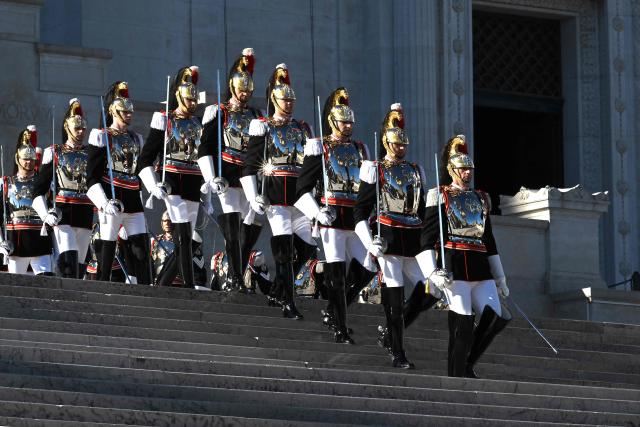 Corazzieri, or Italian military Presidential honour guards, take part in the wreath-laying ceremony at the Tomb of the Unknown Soldier of Victor Emmanuel II Monument for Italy's Liberation Day anniversary, in central Rome, on April 25, 2026. (Photo by Andreas SOLARO / AFP)