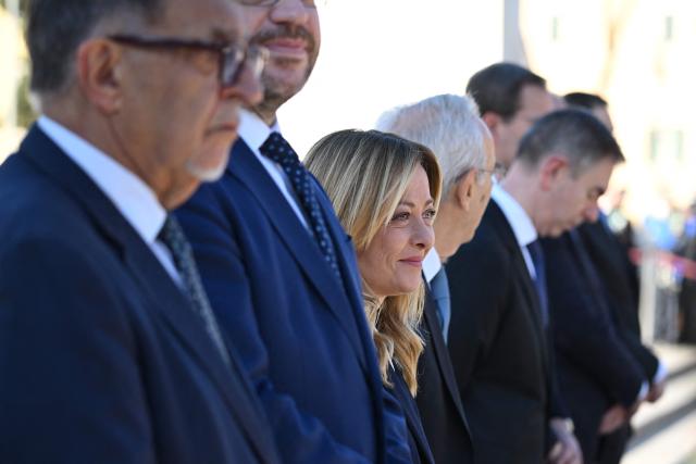 Italy’s Prime Minister Giorgia Meloni (C) attends the wreath-laying ceremony for Italy's Liberation Day anniversary, in central Rome, on April 25, 2026. (Photo by Andreas SOLARO / AFP)